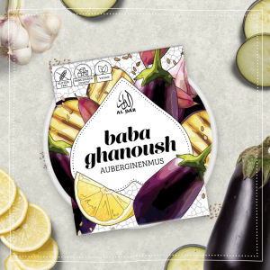 AlDar Mazza Baba Ghanhoush Brotaufstich neben aufgeschnittenen Zitronen, Auberginen und Knoblauch. Labneh ist ein Auberginenmus.